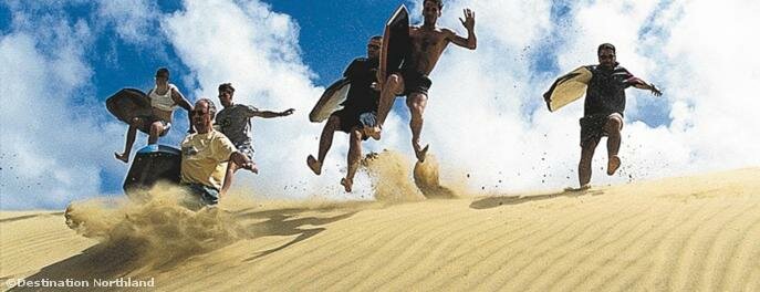  One of the most thrilling activities in the Top of the North is sandboarding down the giant dunes 